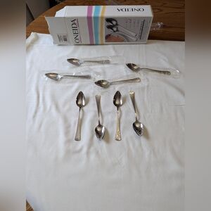 Set of 8 Fruit  spoons . Unused. Serated . Grapefruit Or Other Fruit. Stainless.